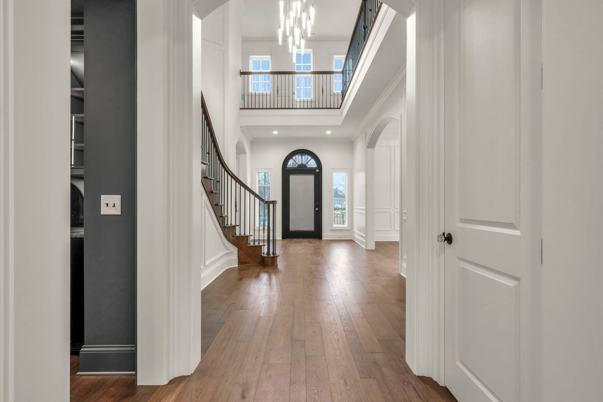 Luxury custom home living room with vaulted ceilings and fireplace
